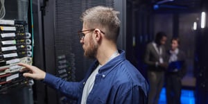 Technician configuring server in data center